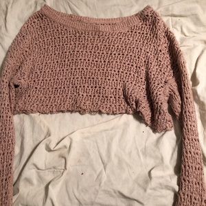 A pink American eagle long sleeve with holes in